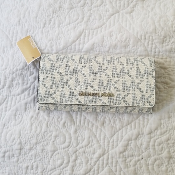 Michael Kors Handbags - Michael Kors Jet Set Travel Carryall wallet Navy